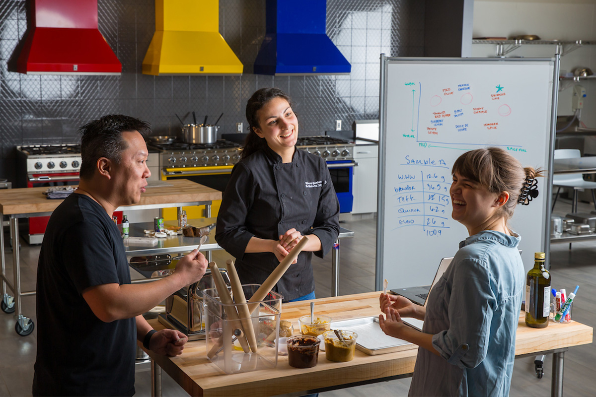 Image of 2 professionals guiding a student 